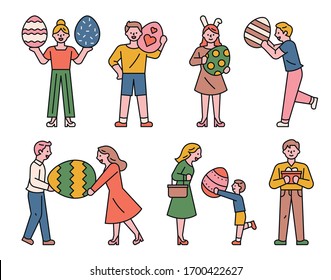 People are holding Easter eggs. flat design style minimal vector illustration.