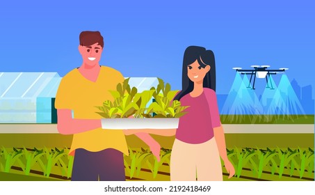 people holding green plants air drone watering field smart farming responsibility of co2 emission environmental conservation