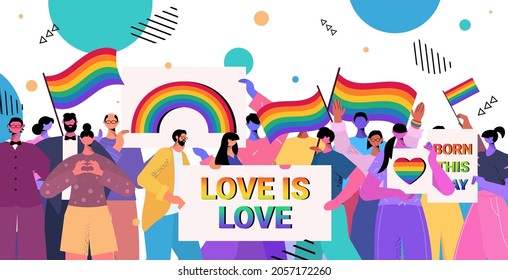 people holding lgbt rainbow flags and placards gay lesbian love parade pride festival transgender love concept