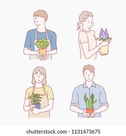 people holding various kind of plant pots. hand drawn style vector design illustrations.