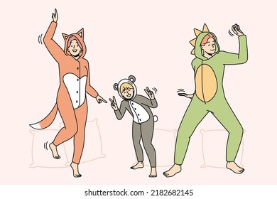 People In Kigurumi Pajamas Have Fun Dancing Indoors. Smiling Adults And Kid Enjoying Pyjama Home Party Together. Leisure Weekend. Vector Illustration. 