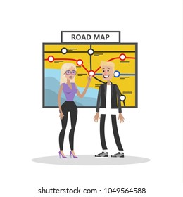 People looking at road map to find the direction.