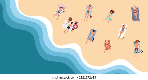 People on the beach or on the seashore relax and sunbathe. View from the top of the ocean.