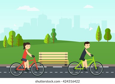 People on bikes ride in the city park.