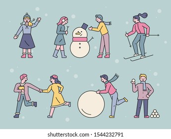 People play happily with their friends on a snowy day. flat design style minimal vector illustration.