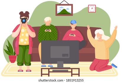 People playing video games. Friends are playing the console. Young girl taking pictures of the guys players. A woman is rooting for her husband. A picture of a typical family weekend in living room