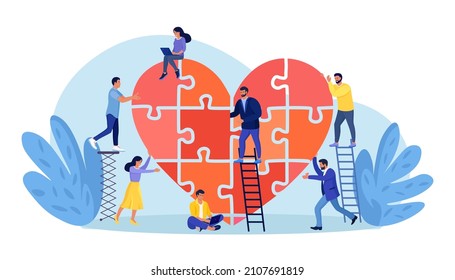 People Put The Puzzle Pieces Together To Red Heart Shape Form. Charity And Donation. Give And Share Your Love To People. Group Of Volunteers Work For Good Purpose In Social Benefit Activity