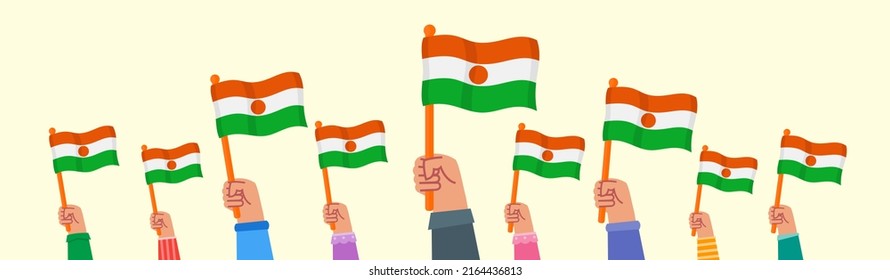 People Raising Niger Flag and Wave it Proudly 