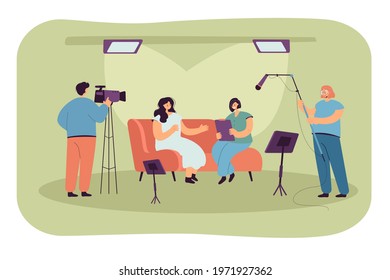 People recording interview in studio. Flat vector illustration. Host, guest person and crew of videographers with cameras filming interview for tv show, news report. Broadcasting, interview concept