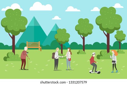 People relaxing in nature in a beautiful urban park, city skyline on the background
