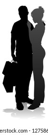 People silhouette of a young man and woman, probably a couple or husband and wife shopping holding retail bags