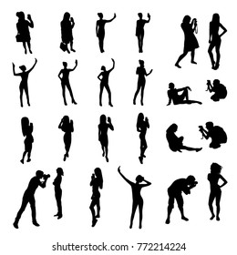 People silhouettes posing for photograph and taking selfie