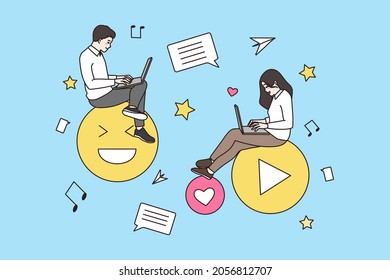 People sit on emoticons chat communicate online with laptops on social media. Smiling man and woman text message on internet at computer. Network, web communication concept. Flat vector illustration. 