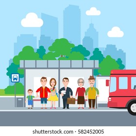 people standing  at the bus stop city landscape