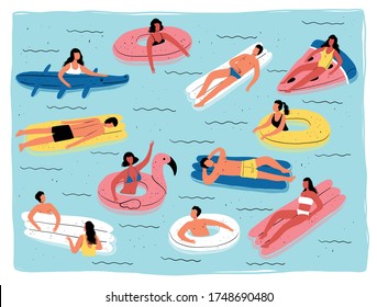 People sunbathe and swim in the pool on inflatable circles and mattresses. Men and women relax, have fun and enjoy the summer.