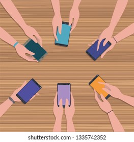 people using smartphones in the table