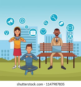People using technology at park