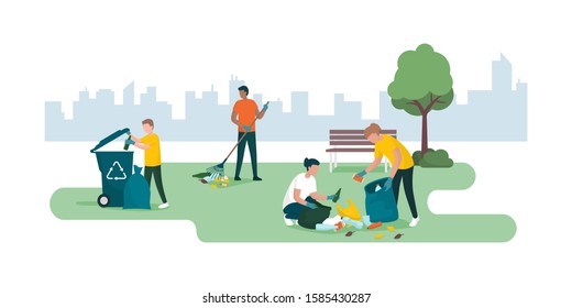 People volunteering and cleaning up a city park together, they are collecting and separating waste, environmental care concept