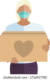 People volunteering to help others in need with boxes of donations during the COVID-19 coronavirus pandemic