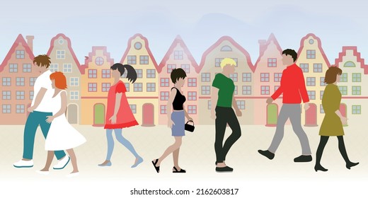 People walk along the street of the old town
