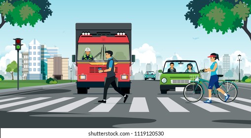 People walking on a crosswalk with a truck stopping at a traffic light.