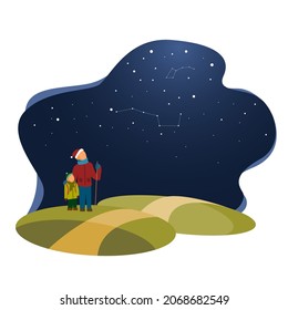 La gente caminando bajo el cielo estrellado por la noche haciendo senderismo la astronomía de padres e hijos