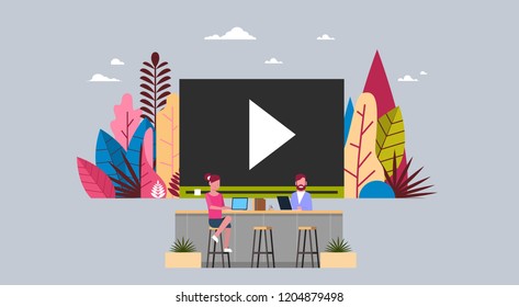 people watch media load concept online video stream service player interface business man and woman working together sit at media office desk flat vector illustration