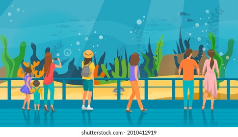 People watching underwater scenery with sea animals in oceanarium. Underwater fauna with fish, seaweed, whale, jellyfish. Marine world representatives. Oceanarium visitors look at fish in aquarium