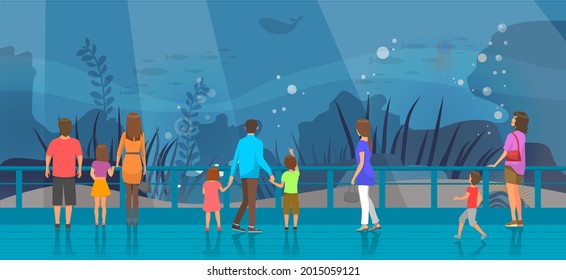 People watching underwater scenery with sea animals in oceanarium. Underwater fauna with fish, seaweed, whale, jellyfish. Marine world representatives. Oceanarium visitors look at fish in aquarium