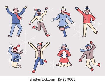 People in winter coats are jumping happily. flat design style minimal vector illustration.