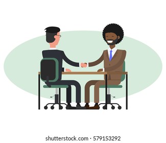 People at work with handshaking on white background. Handshake of two african businessmen behind a desk