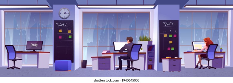 People work in office with rain outside window