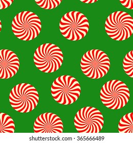 Peppermint candy seamless pattern on green background. Concept for Christmas holiday wrapping paper with mint color sweets. Vector illustration