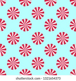 Peppermints Candies Cream Seamless Vector Pattern. Red and White Swirls Isolated on blue background. Christmas Candy Illustration