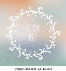 Perfect hand drawn frame on a blured vector background with a place for your text. Circle natural wreath for invitation cards, save the date, wedding card design. 