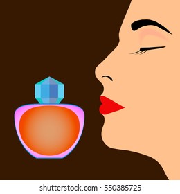 Perfume bottle and profile of woman's face on dark background