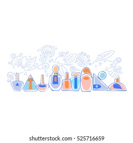 Perfumery.Transparent colored perfume bottles on the shelf