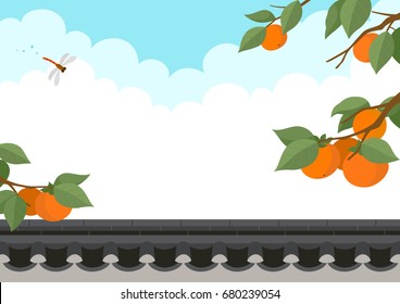 Persimmon tree and dragonfly with traditional Korean style stone wall fence.Autumn harvest holiday background