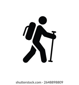 A person with a backpack and walking stick