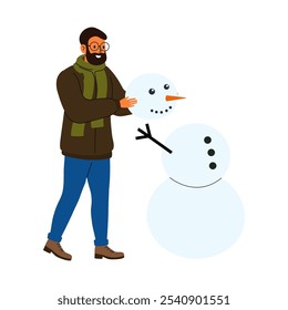 A person builds a snowman during winter in a snowy outdoor setting while enjoying the festive season