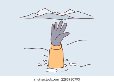 Person caught in avalanche stretches out hand and snowdrift to signal for help and attract attention of rescuers. Traveler is in trouble after uncontrollable natural disaster triggered avalanche 