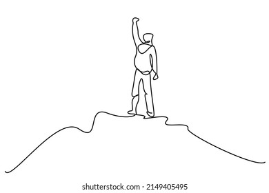 A Person Climbing To The Top Of A Mountain Top Raises His Arms In The Air