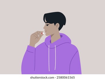 A person in a cozy purple hoodie thoughtfully prepares to take a pill, embracing a moment of self-care and reflection on health and well-being