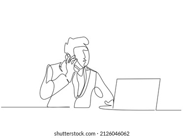 a person in a fake mask is talking on the phone and using a computer at the table