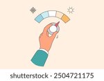 Person hand controls thermostat and increases supply of cold air in home or office. Adjusting thermostat as metaphor for controlling climate change and weather after change of season