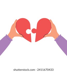 Person holding a heart. Hands connecting jigsaw puzzle in heart. Concept of love, charity and donation.