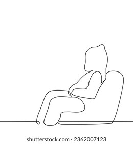 person in hoodie and hood   hands in his pockets sits in profile in an easy chair    one line art vector  concept unknown  anonymous  noname  hacker