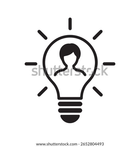 Person inside a glowing lightbulb idea silhouette