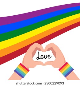 Person making heart with their hands and gay flag in the background