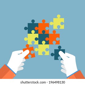 Person making a puzzle. A hand puts proper puzzle. Businessman assembling jigsaw puzzle. Business concept